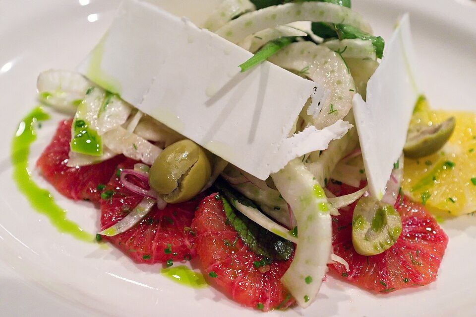 A citrus and fennel salad with shavings of cheese
