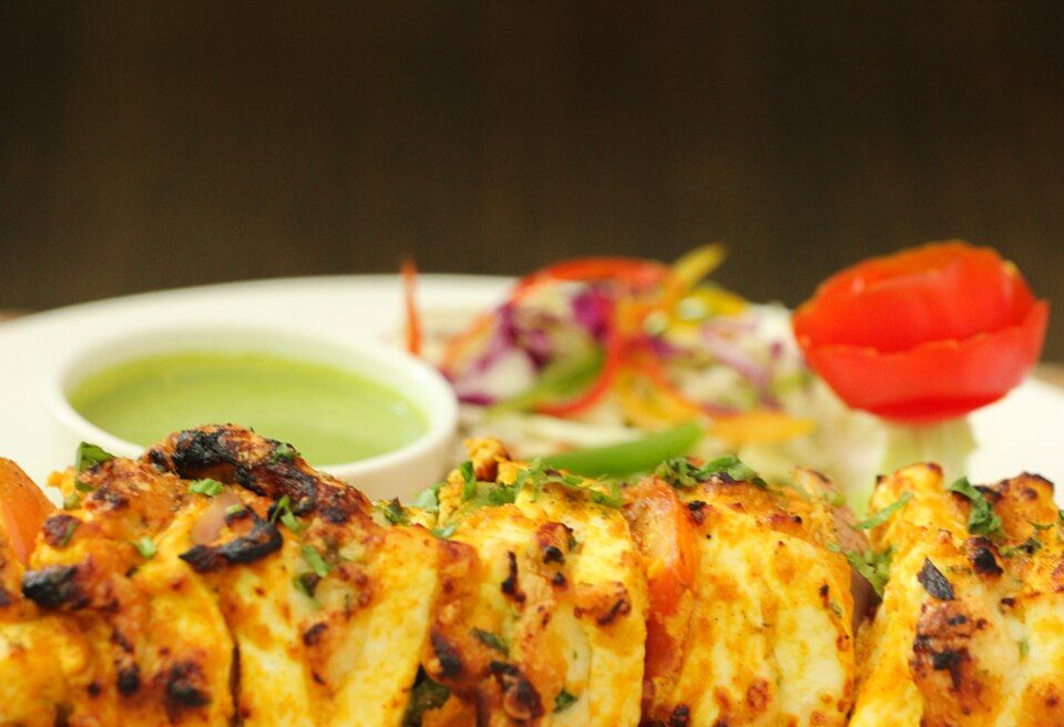 Charred paneer tikka with green chutney and salad
